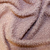 Rose curly fleece fabric sample showing soft textured surface and looped finish