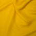 Yellow silky satin fabric sample 85gsm lightweight woven polyester with a fluid drape