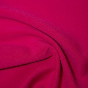 cerise scuba fabric 282gsm stretch knit with smooth handle and structured drape