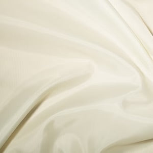 Cream polyester dress lining fabric for dresses, skirts, jackets and crafts