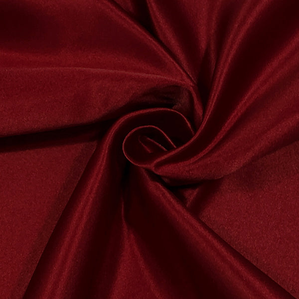 Claret duchess satin fabric with smooth glossy finish draped to show texture
