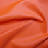 Fluorescent orange scuba fabric 282gsm stretch knit with smooth handle and structured drape