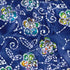Navy 50s cotton batik fabric with white floral and swirl print with green and yellow accents