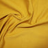 Close-up of ochre bamboo jersey fabric 95 percent bamboo 5 percent elastane 236gsm showing soft stretch knit texture